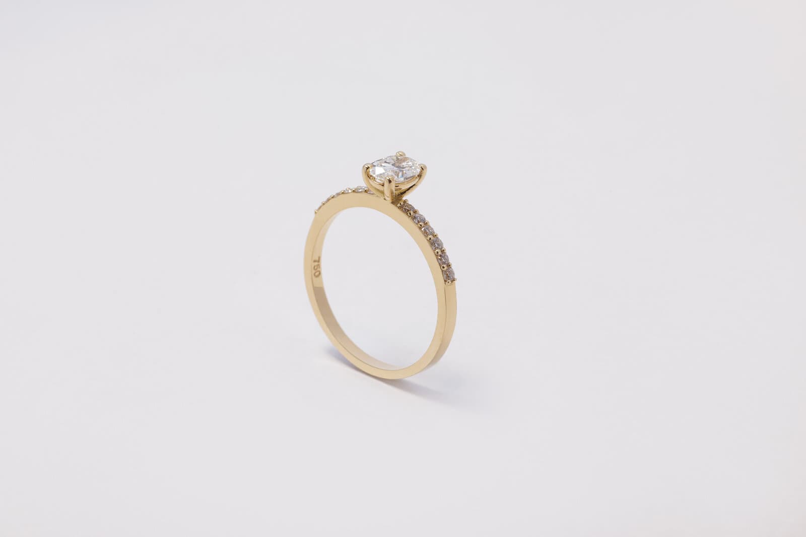 A delicate solitaire oval ring with a diamond band - 2