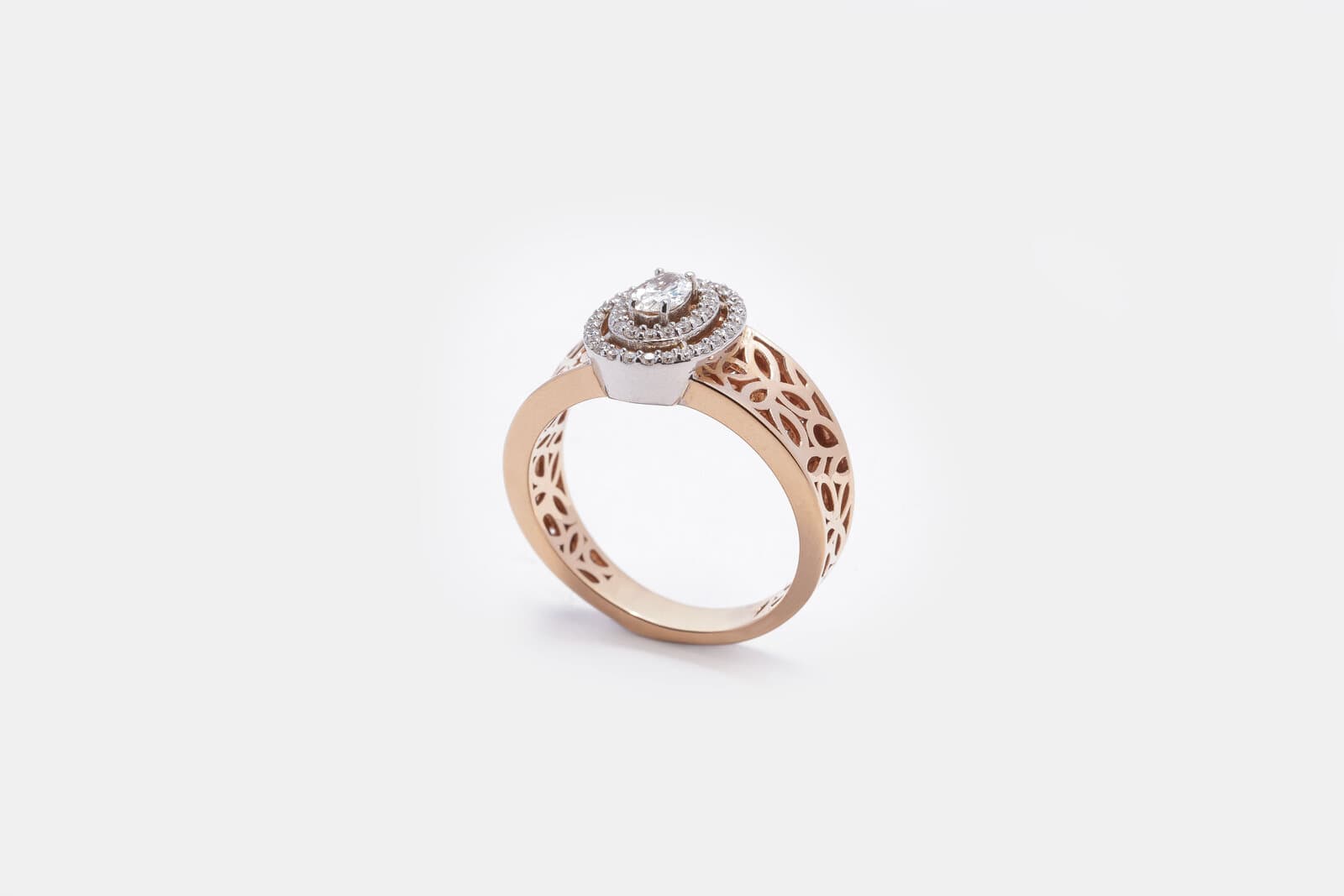 Handcrafted oval diamond with two halos and designed band