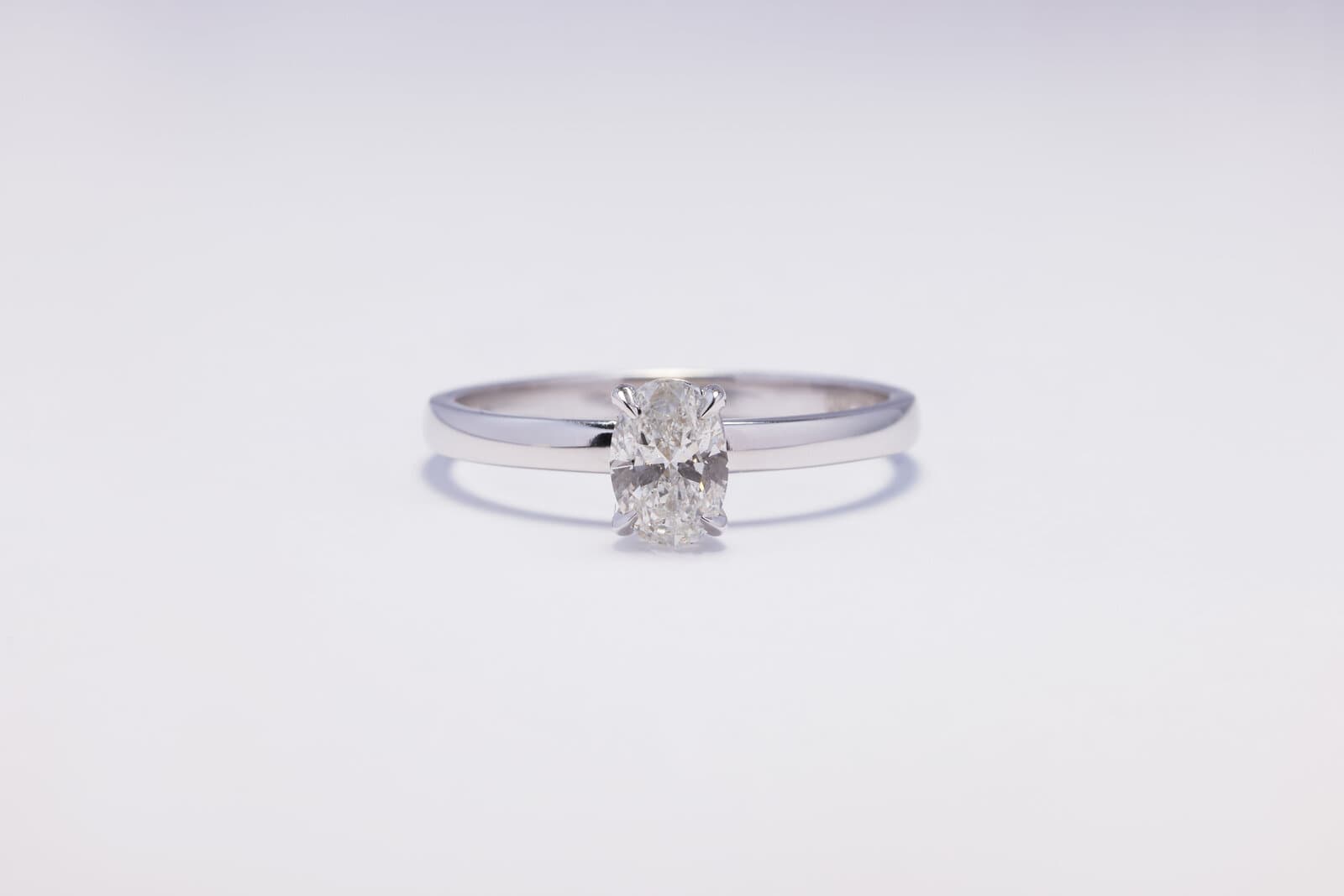 Handcrafted 18k oval shape solitaire ring with natural diamonds